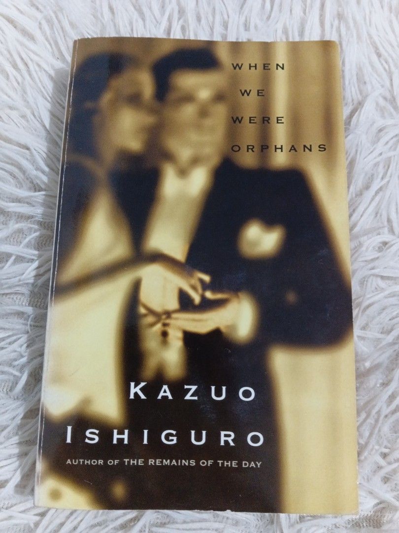 When We Were Orphans by Kazuo Ishiguro Paperback (Category: Storybooks) located in Cavite. Submitted by nathstelein_finds (Listing ID 1467072485, Image 1). Description: - Title: When We Were Orphans by Kazuo Ishiguro - Publisher: Vintage International (Paperback) - Condition: Preloved with visible yellowing from age, light edge wear, and spine creasing - Durability: Binding is fully intact, clean pages, and 100% readable - Perfect for: Contempora