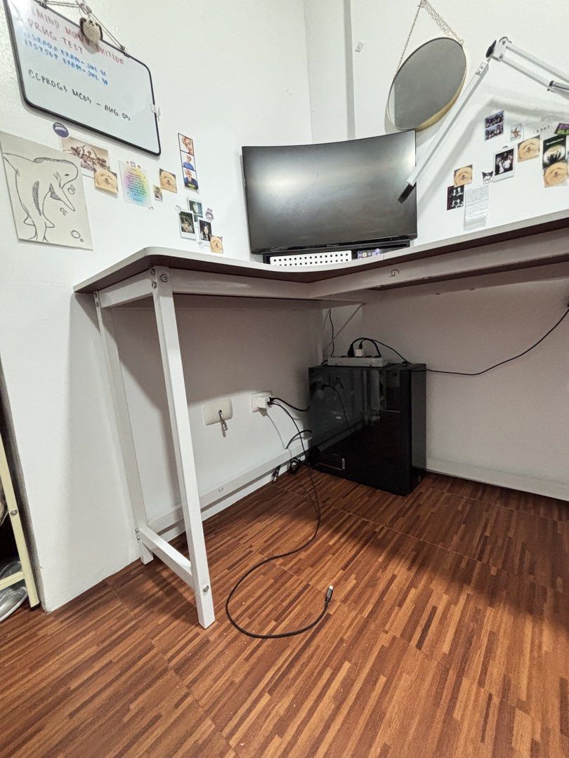 While L-Shaped Computer Table (Category: Office Furniture & Fixtures) located in Manila. Submitted by leonejinn (Listing ID 1467133528, Image 2). Description: METRO MANILA AREA Original Price: ₱2,570 Selling Price: ₱1,500 140CM, L-shaped White table, Left side, Metal table legs. Price is Non-negotiable, Good condition, little damage on the edges when i bought it, Buyer will carry the bill of delivery. Reason for selling: Saving for tuition. Payme