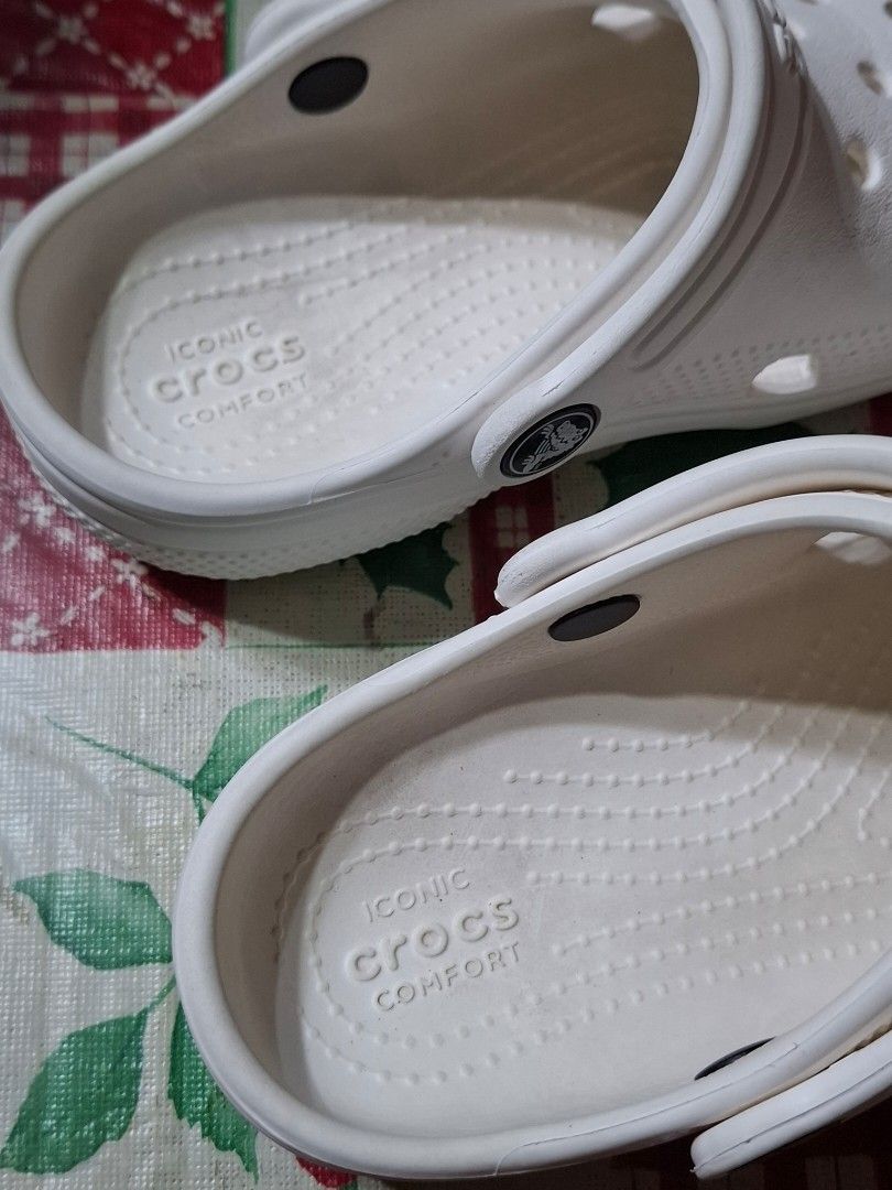 White Crocs Classic Clogs Size C11 (Category: Babies & Kids Fashion) located in Bulacan. Submitted by Krizzy_Things (Listing ID 1467076527, Image 3). Description: - Authentic White Classic Crocs Clogs - Size: C11 (marked on soles) - Iconic comfort cushioning for all-day wear - Breathable ventilation holes on top and sides - Secure pivoting heel strap with Crocs logo - Lightweight, water-friendly, and slip-on design - Textured outsoles for reliabl