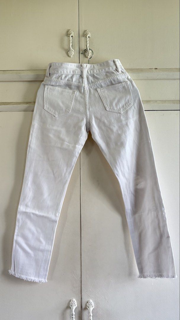 White Distressed Ripped Denim Jeans Raw Hem (Category: Jeans) located in Manila. Submitted by nanah0930 (Listing ID 1467002817, Image 2). Description: - Color: Clean white - Fit: Mid-rise with standard belt loops - Details: Distressed knee rips and trendy raw frayed ankle hems - Pockets: Functional front and back pockets - Style: Versatile casual staple for daily wear.