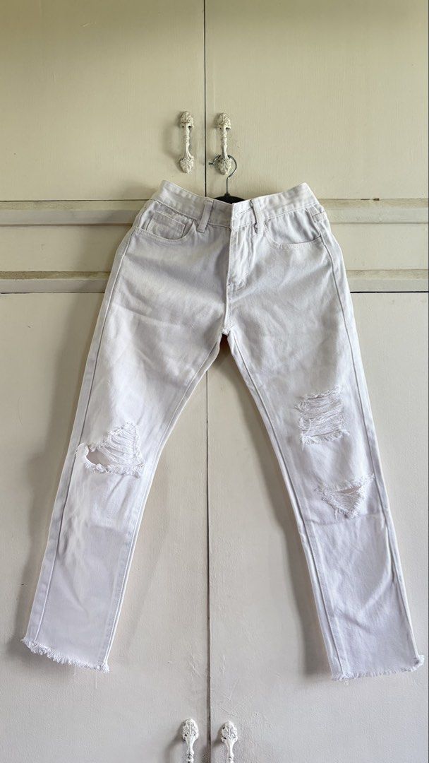 White Distressed Ripped Denim Jeans Raw Hem (Category: Jeans) located in Manila. Submitted by nanah0930 (Listing ID 1467002817, Image 1). Description: - Color: Clean white - Fit: Mid-rise with standard belt loops - Details: Distressed knee rips and trendy raw frayed ankle hems - Pockets: Functional front and back pockets - Style: Versatile casual staple for daily wear.