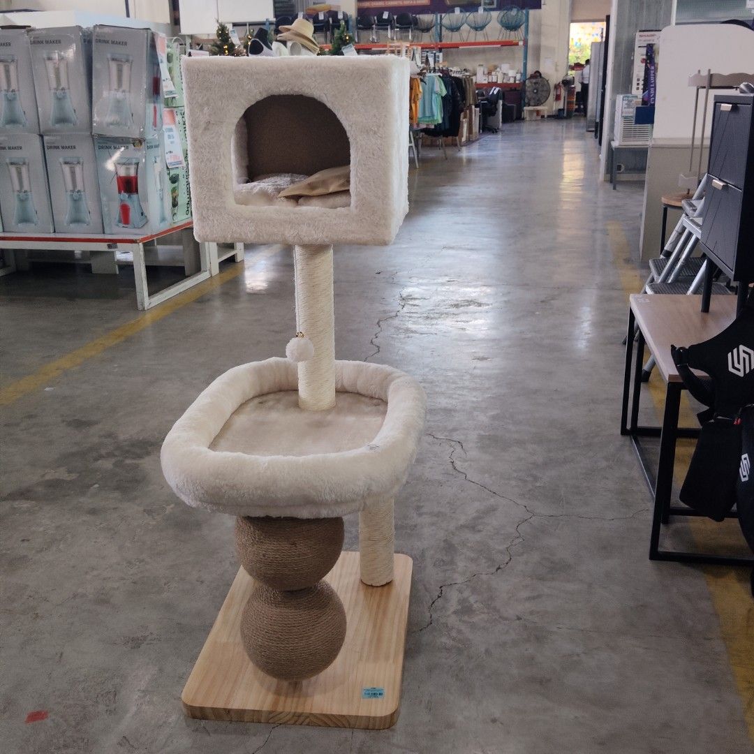 White fluffy cat tree with condo and scratching posts (Category: Homes & Other Pet Accessories) located in Caloocan City. Submitted by budlat944-45384 (Listing ID 1466997750, Image 1). Description: - Color: Soft white plush fabric - Features: Cozy top condo with cushion, open middle platform, and hanging toy - Durability: Wrapped with natural jute rope scratching posts - Stability: Sturdy wooden base - Condition: Brand new.