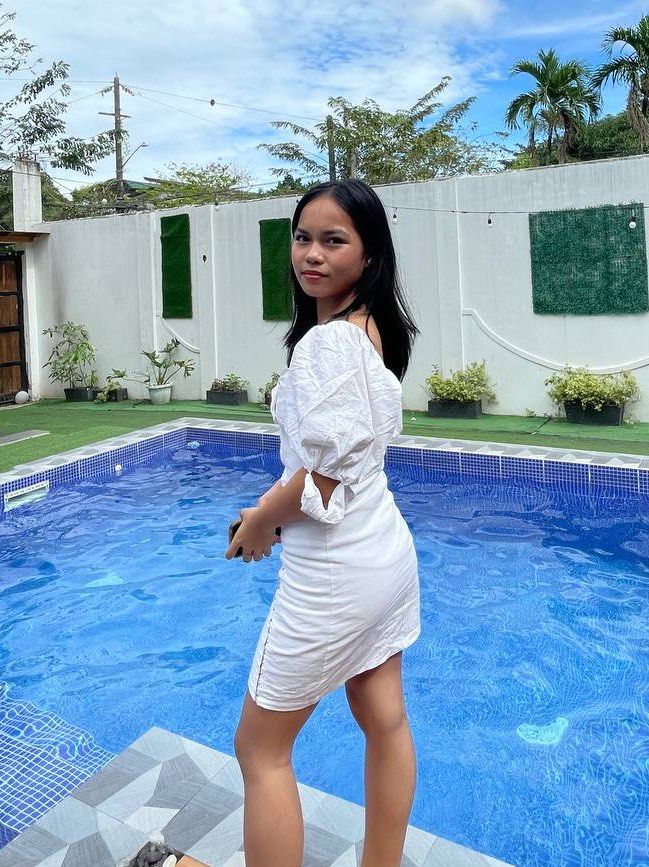 White off-shoulder puff sleeve mini dress (Category: Dresses) located in Manila. Submitted by rhiangastadora (Listing ID 1467036490, Image 3). Description: - Color: White - Style: Off-shoulder mini dress with a fitted bodycon silhouette - Details: Dramatic puff sleeves, sweetheart neckline with front tie, and asymmetrical diagonal hook-and-eye closure - Closure: Convenient back zipper - Ideal for: Resort wear, pool days, and outdoor brunch dates.