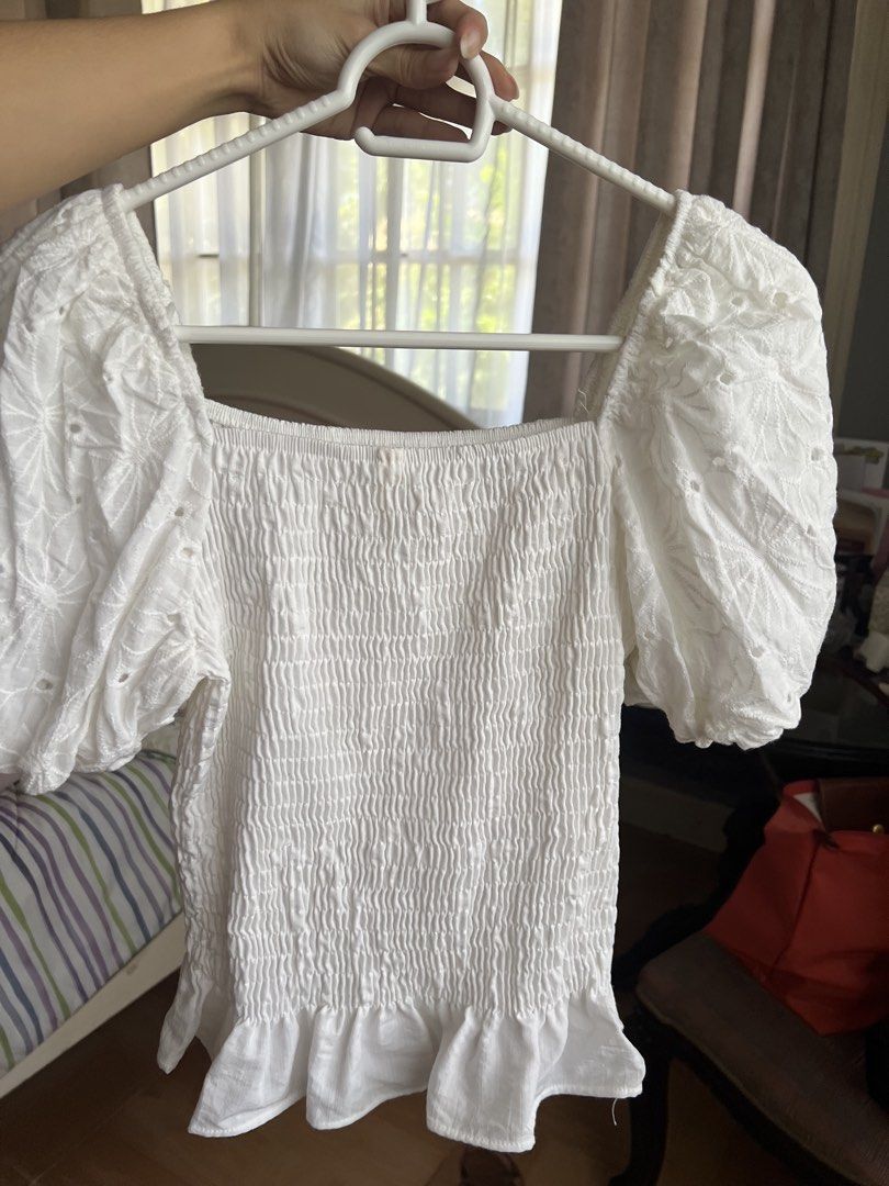 White Square Neck Smocked Puff Sleeve Top (Category: Blouses) located in Bulacan. Submitted by fallongallon (Listing ID 1467019577, Image 3). Description: - Color: White - Neckline: Trendy square neck - Details: Stretchy smocked body, gorgeous embroidered puff sleeves, and a cute ruffle hem - Styling: Great basic piece, easy to pair with high-waisted jeans or skirts - Season: Perfect for warm weather/sunny days.