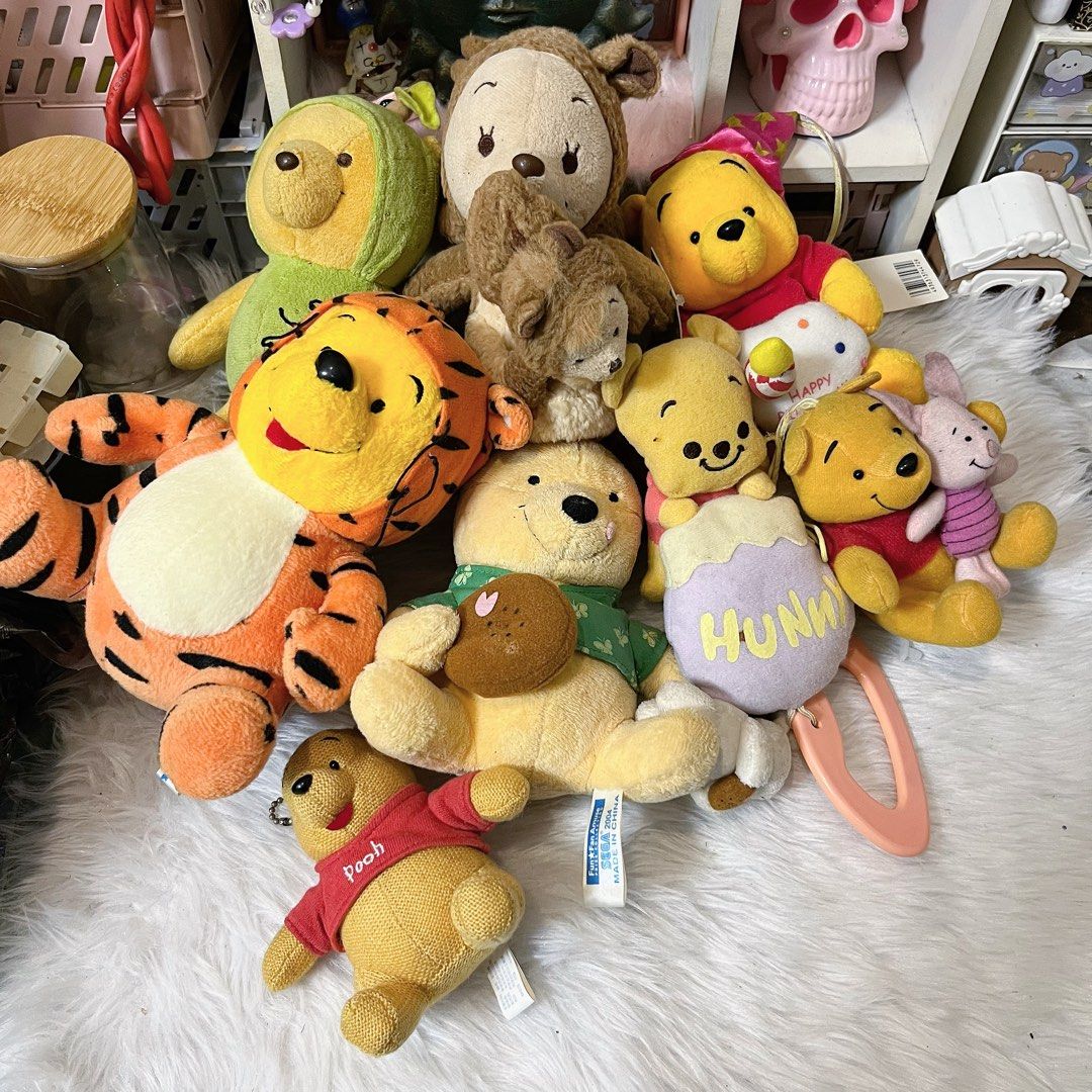 winnie the pooh bundle (Category: Plushies & Soft Toys) located in Malolos. Submitted by babebunzz (Listing ID 1467019558, Image 1). Description: - Complete Winnie the Pooh plush bundle set - Includes Tigger, Piglet, and multiple Pooh variants - Features various sizes and cute outfits - Clean and well-maintained condition - Ideal for Disney fans and toy collectors - Selling as a bundle only (no individual sales).