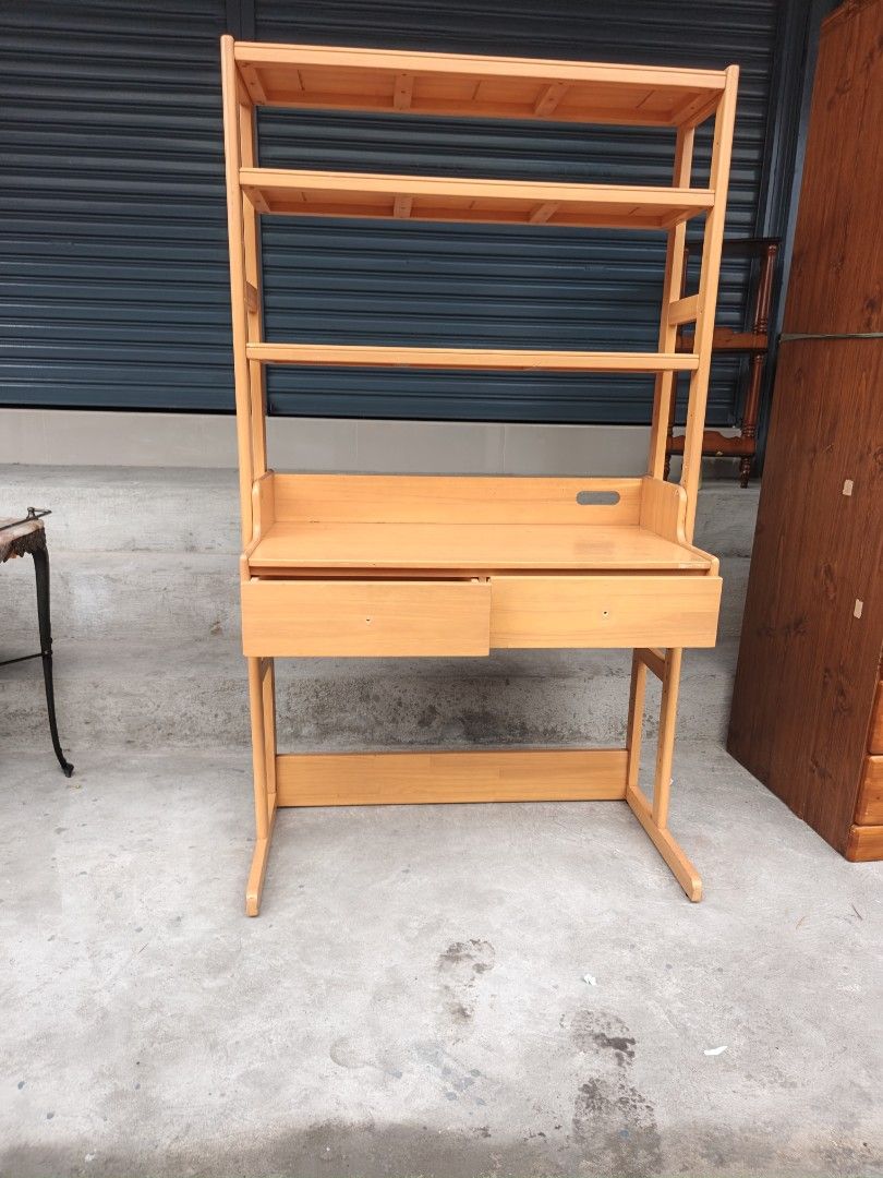 Wooden Study Desk with Bookshelf (Category: Tables & Sets) located in Valenzuela. Submitted by kendra071914 (Listing ID 1466993699, Image 2). Description: - Type: Wooden study desk with built-in bookshelf tower - Finish: Clean light wood finish - Storage: 2 pull-out drawers & 3 open shelves for books and essentials - Build: Sturdy and durable frame construction - Dimensions: 90cm (L) x 44cm (W) x 155cm (H) - Condition: Brand new / Excellent - Per