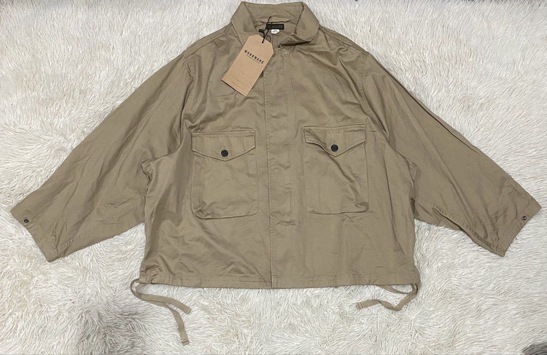 Workware Heritage Clothing Co. Khaki Jacket Size Medium (Category: Coats, Jackets and Outerwear) located in Antipolo. Submitted by switchneighborhood (Listing ID 1467118056, Image 1). Description: - Brand: Workware Heritage Clothing Co. - Condition: Brand new with tag still attached - Size: Medium fits XL - Color: Khaki - Style: Utility jacket - Features: Two large front chest pockets, button closures, adjustable drawstring hem, and button detail