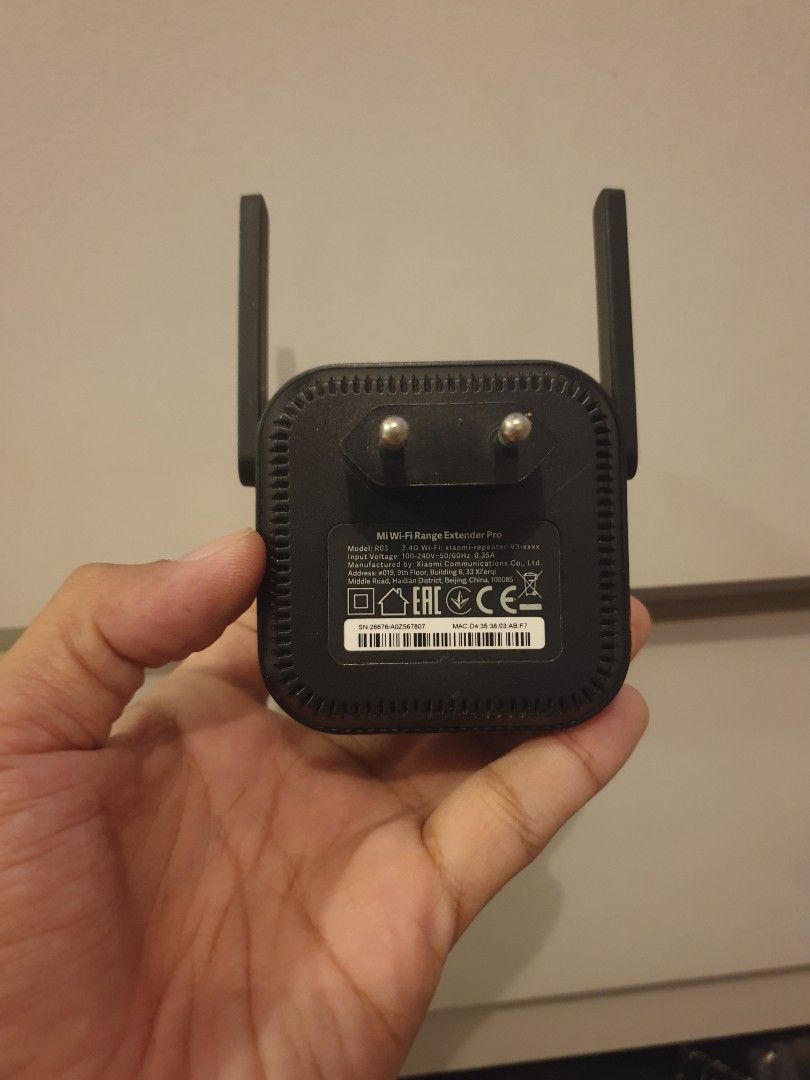Xiaomi Mi Wi-Fi Range Extender Pro R03 (Category: Networking) located in Manila. Submitted by lesterjohn17980 (Listing ID 1467002388, Image 3). Description: - Brand: Xiaomi Mi Wi-Fi Range Extender Pro (Model R03) - Design: Sleek black housing with dual external antennas - Convenience: Plugs directly into any wall socket - Performance: Effectively eliminates dead zones and expands wireless coverage - Setup: Quick and easy installation via mobile a