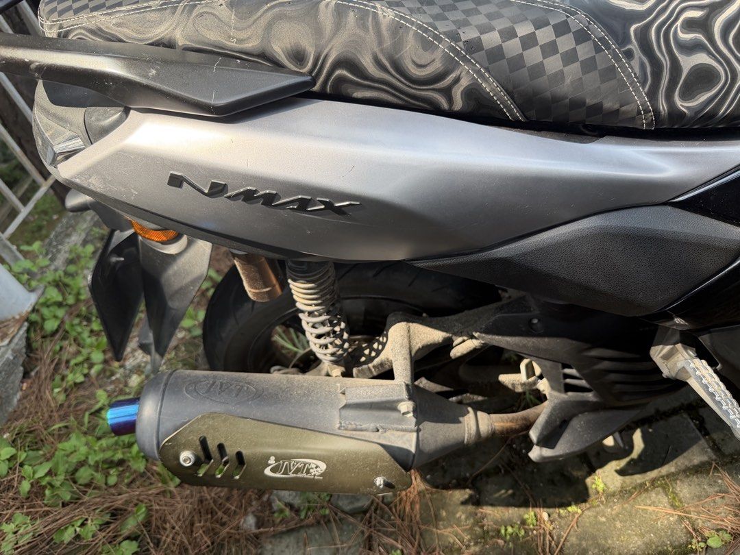 Yamaha NMAX v3 standard (Category: Motorbikes for Sale) located in Manila. Submitted by ballenwilm84291 (Listing ID 1467160018, Image 1). Description: Yamaha NMAX scooter finished in silver and black. Custom patterned seat with a compass-style emblem on top. JVT exhaust pipe installed with a blue tip. Windshield features playing card stickers and a Relax graphic. Dual rearview mirrors attached. Footboards and side panels show normal wear from dai