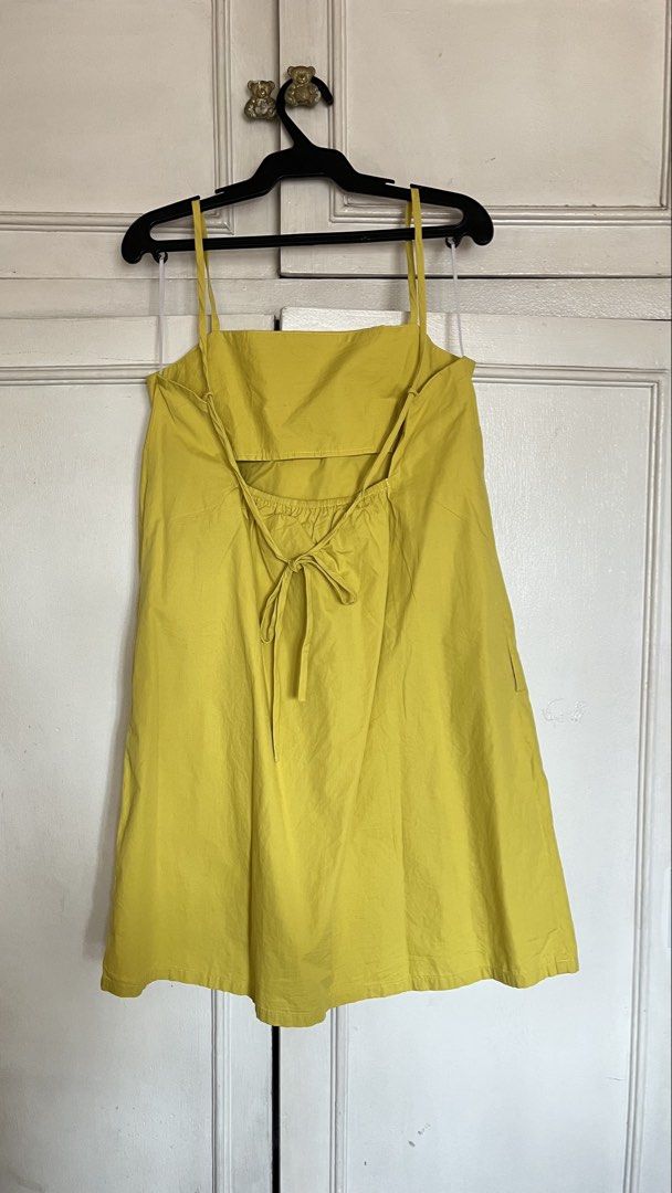Yellow mustard spaghetti strap backless mini dress open back (Category: Dresses) located in Quezon City. Submitted by jellycooties (Listing ID 1467024541, Image 1). Description: - Color: Bright yellow - Material: Lightweight cotton - Style: Summer mini dress - Neckline: Straight front - Straps: Thin spaghetti straps - Back Details: Open back with thin adjustable ties and a bow - Waist: Subtle elasticated waistband.