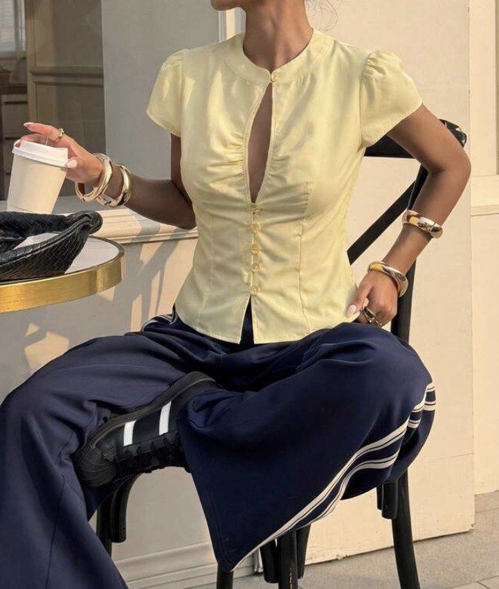 Yellow Short Sleeve Keyhole Blouse with Button (Category: Blouses) located in Quezon City. Submitted by liana.finds (Listing ID 1467156049, Image 2). Description: - Color: Butter yellow - Design: Button-down front with short cap sleeves - Neckline: Keyhole cutout with gathered ruching down the front - Fit: Slim fit through the torso with shaped seams - Material: Smooth, comfortable fabric - wore once.