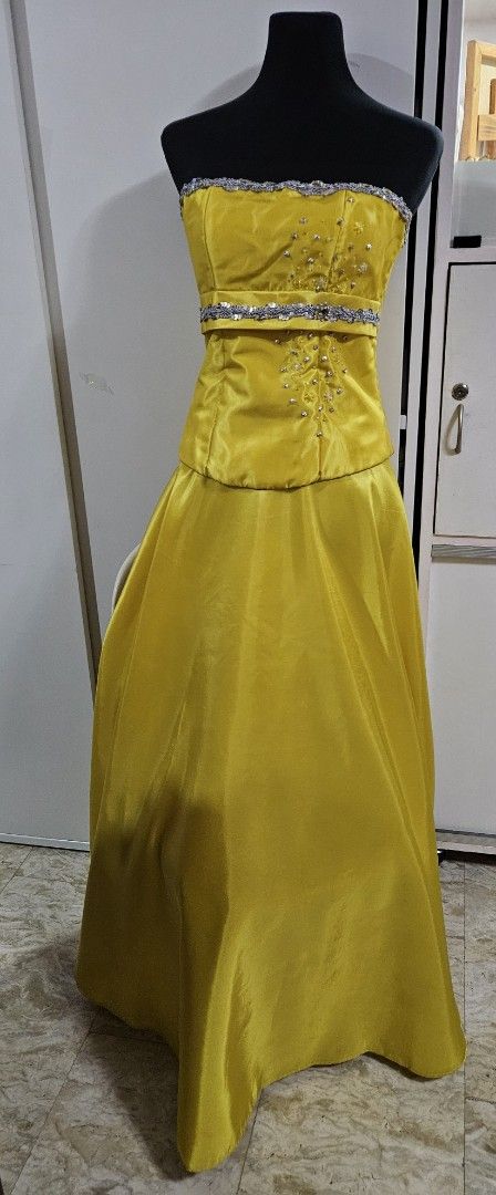 Yellow Two Piece Strapless Beaded Evening Gown (Category: Evening dresses & gowns) located in Caloocan City. Submitted by rm.diaz (Listing ID 1467015031, Image 1). Description: - Color: Bright yellow - Style: Two-piece formal gown - Bodice: Strapless with silver sequin trim and crystal bead clusters - Skirt: Matching maxi skirt with smooth satin finish and floor-length flare - Closure: Back zipper on both pieces - Ideal for: Proms, banquets, and 