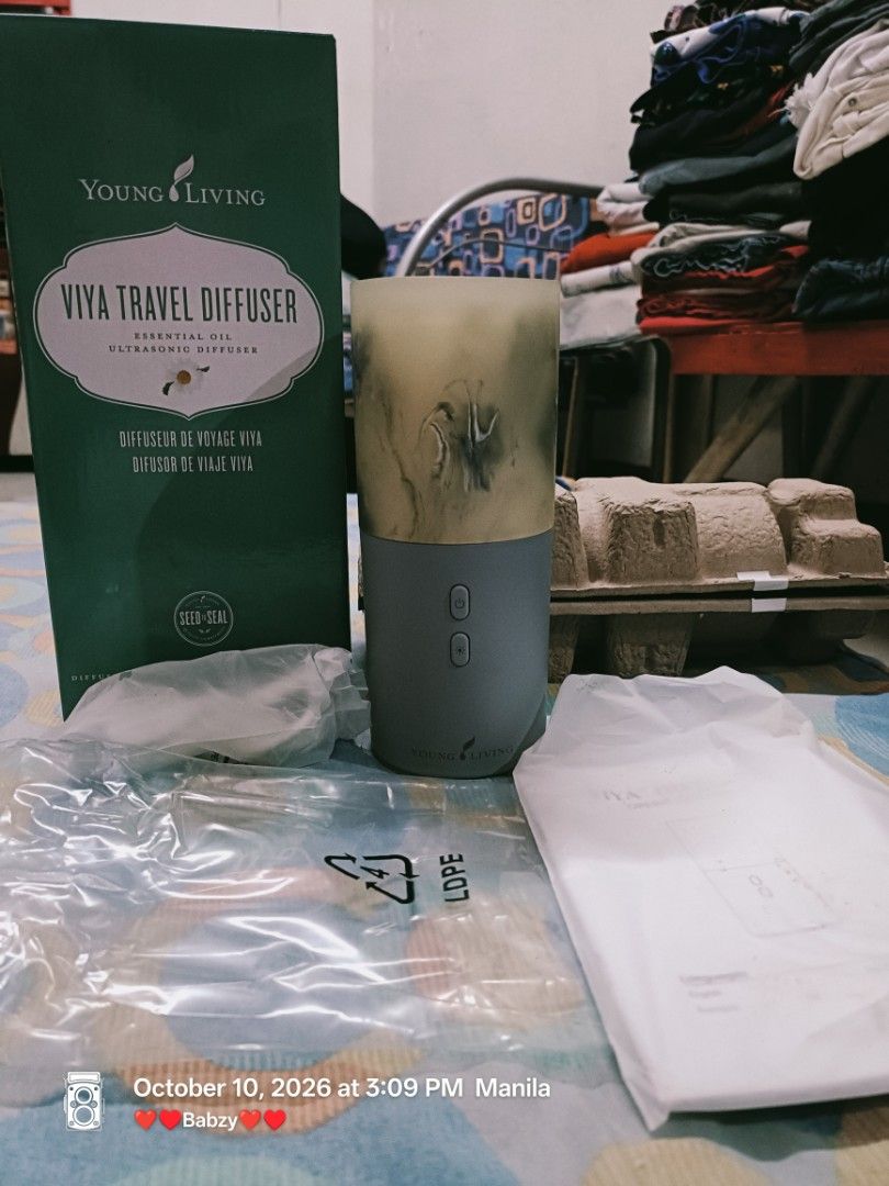 Young Living Viya Travel Diffuser (Category: Home Fragrance) located in Manila. Submitted by iambabzy (Listing ID 1467034065, Image 1). Description: - Authentic Young Living Viya travel diffuser in original green packaging - Opened box complete set with ultrasonic unit and grey base - Includes power cord, instruction manual, and packaging insert - Compact and portable design ideal for travel or home use - Easy-to-use essential oil diffuser setup.