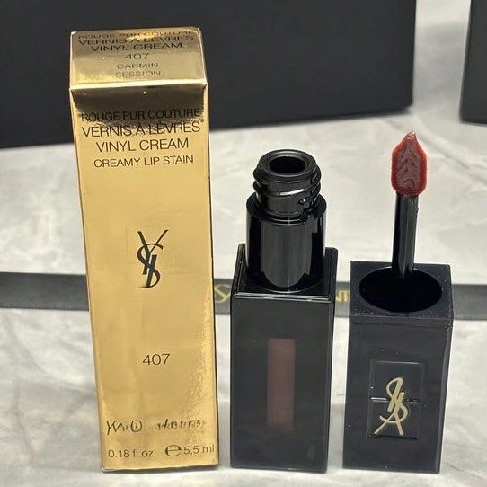 YSL creamy lipstick #407 (Category: Makeup) located in Manila. Submitted by santanajdd (Listing ID 1466813263, Image 1). Description: YSL Vinyl Creamy Lip Stain 💗 * shade: 407 Carmin Session * high coverage lip stain with glossy finish * beautiful muted rose, plum color * comes with original packaging * authentic, never used - doesn't fit my personal makeup looks 💬 dm for more info!.