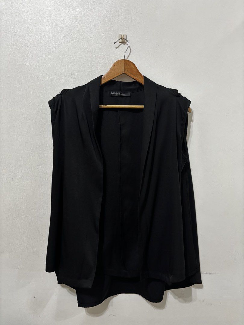 Zanzea Collection Black Open Front Blazer Size L (Category: Coats, Jackets and Outerwear) located in Makati City. Submitted by maqui0730 (Listing ID 1467033553, Image 3). Description: - Used once - Brand: Zanzea Collection - Size: L (tag attached inside collar) - Color: Plain Black - Style: Open front with drape lapel and structured shoulders - Sleeves: Long sleeves - Material: Smooth fabric - Condition/Use: Great for casual office wear or everyd