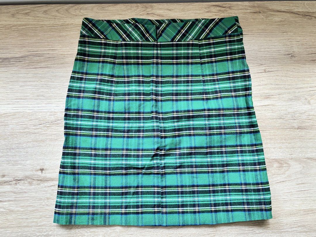Zara Basic Green Plaid Tartan Mini Skirt Size S (Category: Skirts) located in Paranaque City. Submitted by ggg.bin (Listing ID 1466975980, Image 2). Description: - Brand: Zara Basic - Style: Green tartan plaid mini skirt - Color: Green, blue, and black checkered pattern - Size: S / US S / MEX 26 - Origin: Made in Morocco - Condition: Clean inside and out - Details: Features a chic waistband, perfect for layering with sweaters and boots.