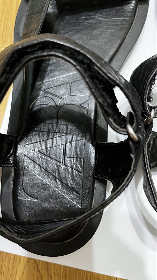 Zara Black Crocodile Embossed Flat Sandals Size 36 (Category: Flats & Sandals) located in Pasig City. Submitted by ___she___ (Listing ID 1467126670, Image 3). Description: - Brand: Zara - Style: Flat sandals - Color: Black - Size: EU 36 - Details: Crocodile-embossed front and heel straps, metal ring hardware, and large embossed Zara logo on the footbed - Closure: Velcro ankle strap - Sole: Flat rubber sole - Condition: Worn a few times, with mino