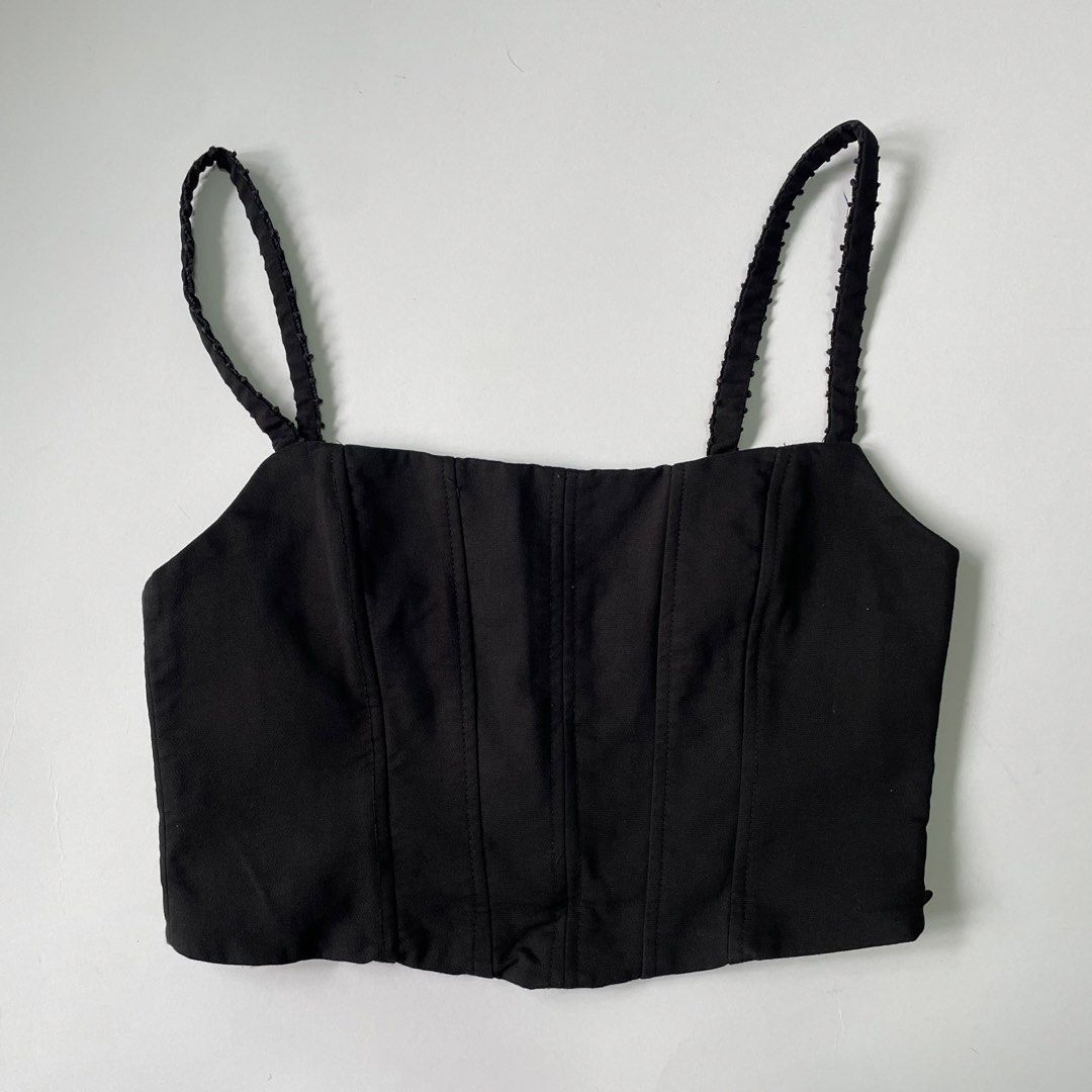 Zara Black square neck corset crop top (Category: Sleeveless) located in Pasay City. Submitted by lovedbyzea (Listing ID 1467049068, Image 2). Description: - Color: Black - Style: Corset crop top with square neckline and structured front boning - Details: Textured, dotted shoulder straps and convenient side zipper closure - Fit: Cropped length, perfect for high-waisted jeans or skirts - Condition: Clean fabric with minimal wear.