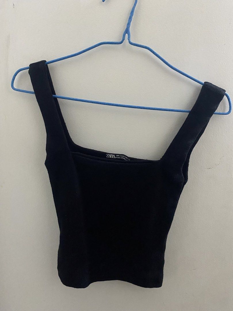 Zara Black Square Neck Ribbed Tank Top (Category: Sleeveless) located in Angeles City. Submitted by kooarchives (Listing ID 1467066496, Image 3). Description: - Brand: Zara - Style: Square neck cropped tank top - Size: Small (S) - Material: Stretchy ribbed knit - Condition: Excellent, worn a few times and well-maintained - Features: Snug fit, sits right above the waist, no loose threads - Versatility: Easy to style with high-waisted pants or skir