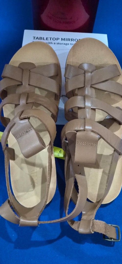 Zara Brown Strappy Flat Sandals (Category: Flats & Sandals) located in Manila. Submitted by pixiedachi (Listing ID 1467036680, Image 3). Description: - Brand: Zara - Style: Brown strappy gladiator sandals with minimalist design - Closure: Adjustable ankle buckle - Sole: Comfortable flat sole - Versatility: Perfect for warm weather, easily matches shorts, skirts, and dresses GENUINE LEATHER .