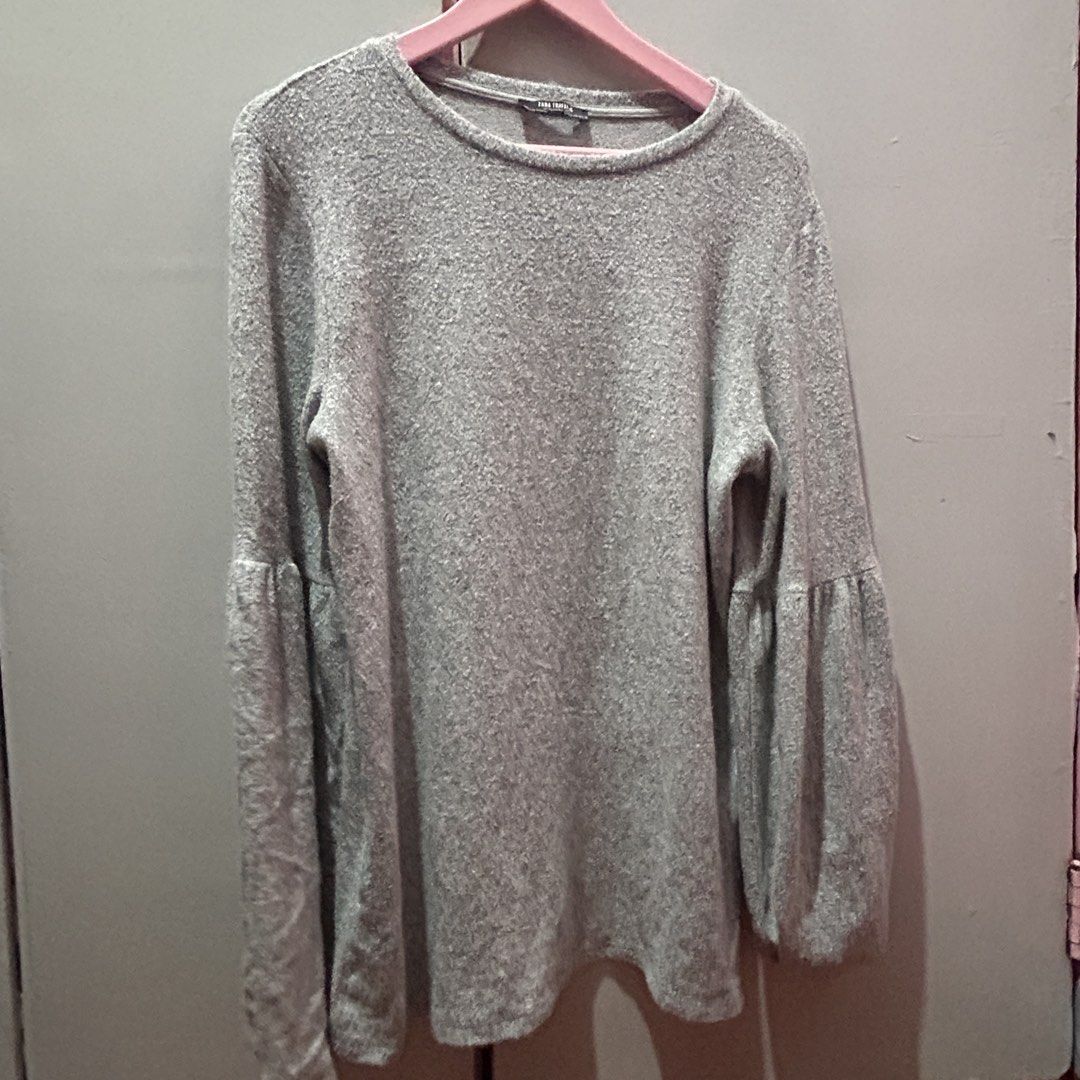 Zara Grey Textured Long Sleeve Sweater (Category: Longsleeves) located in Mandaluyong City. Submitted by strawbyeries (Listing ID 1467145245, Image 1). Description: - Brand: Zara - Color: Versatile neutral grey - Design: Textured knit with rounded neckline and stylish bell sleeves from the elbow - Fit: Relaxed and comfortable - Condition: Excellent, ready to wear - Perfect for casual days and easy to match with any outfit!.
