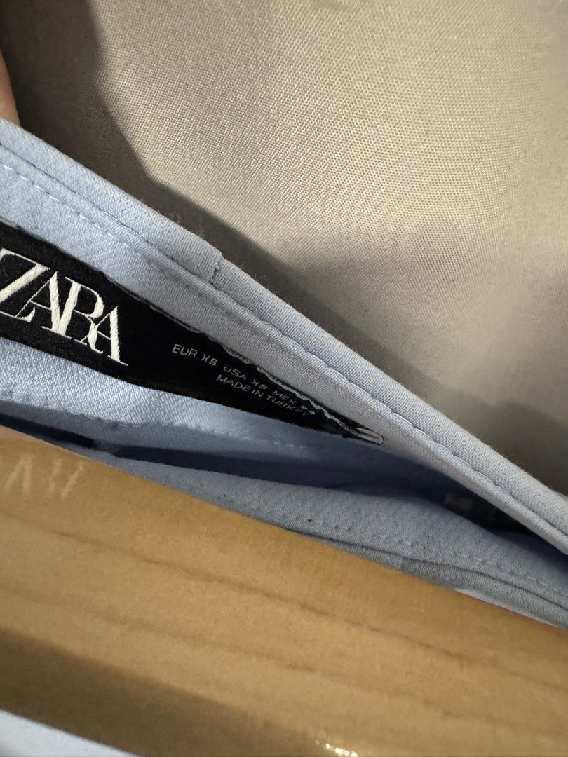 Zara Light Blue Wrap Skort Size XS (Category: Skirts) located in Manila. Submitted by decluterthings888 (Listing ID 1467167643, Image 2). Description: - Brand: Zara - Color: Light Blue - Size: XS - Origin: Made in Turkey - Style: Wrap-style front overlay panel with side zipper closure - Condition: Clean fabric, perfect casual piece for warm weather.