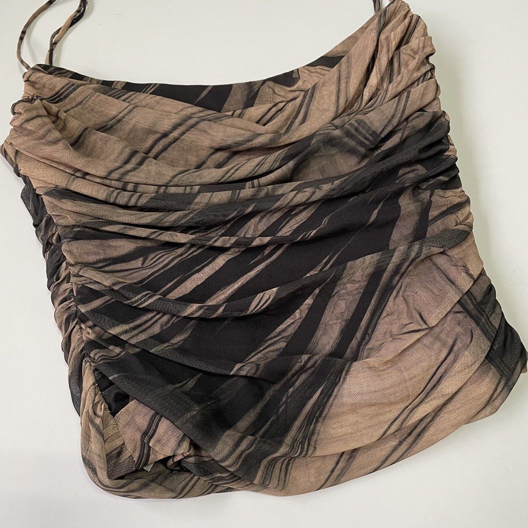 Zara Mesh Ruched Corset (Category: Sleeveless) located in Pasay City. Submitted by lovedbyzea (Listing ID 1467048283, Image 2). Description: - Brown and black abstract printed camisole - Sheer mesh fabric with all-over ruching detail - Features spaghetti straps, straight neckline, and side zipper closure - Soft, stretchy, and fits true to size - Versatile piece for casual day outs or evening wear.