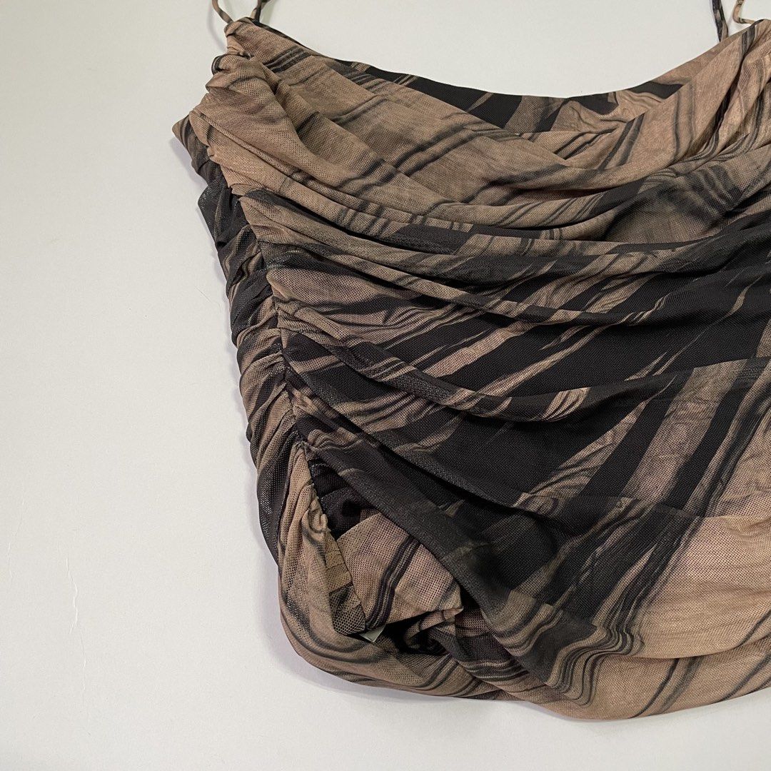 Zara Mesh Ruched Corset (Category: Sleeveless) located in Pasay City. Submitted by lovedbyzea (Listing ID 1467048283, Image 3). Description: - Brown and black abstract printed camisole - Sheer mesh fabric with all-over ruching detail - Features spaghetti straps, straight neckline, and side zipper closure - Soft, stretchy, and fits true to size - Versatile piece for casual day outs or evening wear.