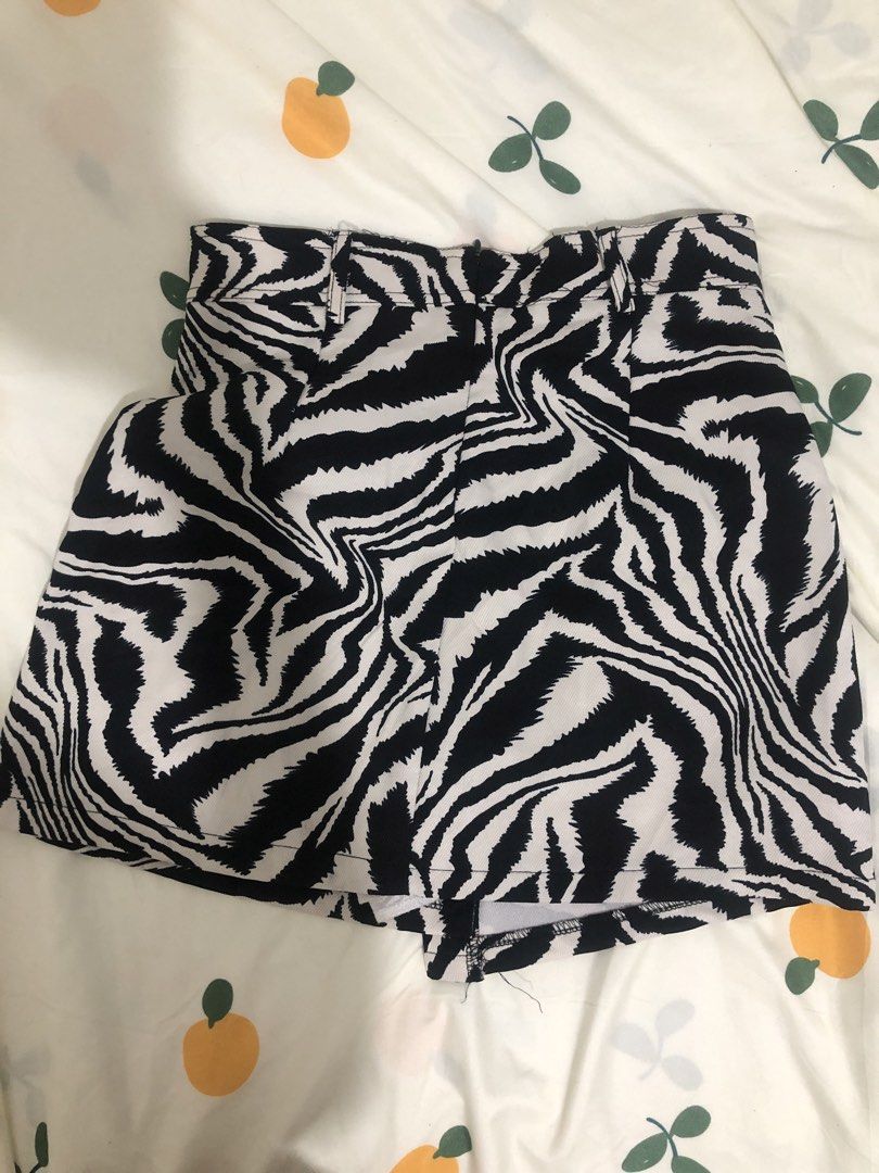 Zebra Print High Wait Skort (Category: Shorts) located in Quezon City. Submitted by maggie.styles (Listing ID 1467130251, Image 2). Description: - Trendy black and white zebra print all over - Flattering high-waisted fit with belt loops - Features practical front pockets - Clean back cut with zip closure - Fun and easy to style with basic solid tops.