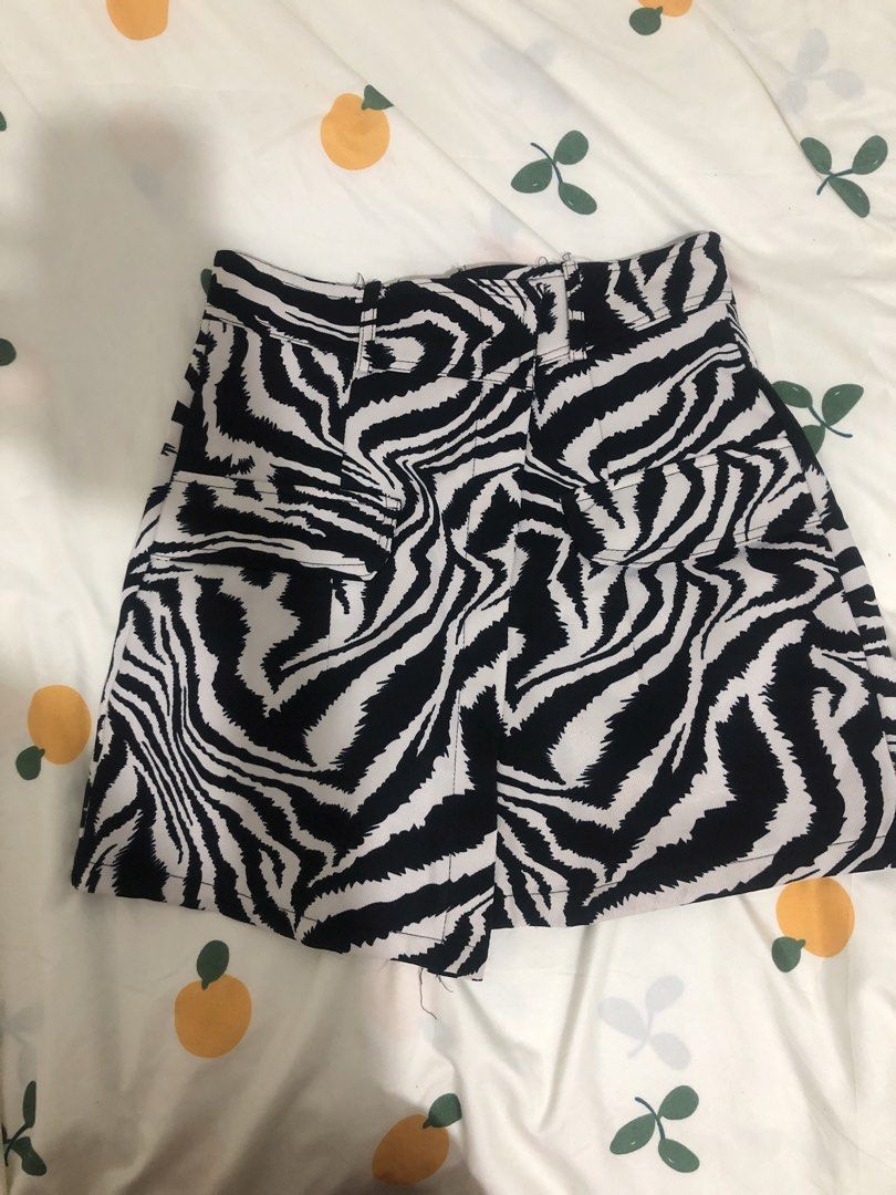Zebra Print High Wait Skort (Category: Shorts) located in Quezon City. Submitted by maggie.styles (Listing ID 1467130251, Image 1). Description: - Trendy black and white zebra print all over - Flattering high-waisted fit with belt loops - Features practical front pockets - Clean back cut with zip closure - Fun and easy to style with basic solid tops.