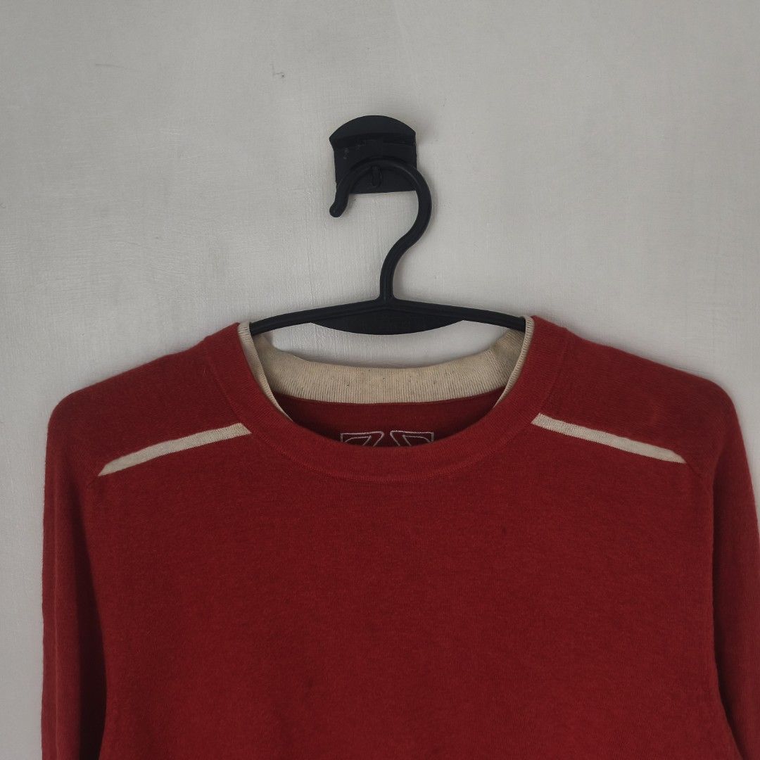 Zegna sport sweater (Category: Luxury Apparel) located in Tayabas. Submitted by cat.b0i (Listing ID 1467095345, Image 2). Description: Size on tag: Fitting: Men - L-Cropped Semi XL Women - XL ‎Length: 25 ‎Width: 21 ‎Shoulder: none (raglan build) ‎Arm Space: 9.5 ‎Sleeve Length: 29 ‎ ‎Color: red orange with beige accents Color Rate: 9.2 ‎Material: unsure because I can't find washtag but feels cotton-cashmere properties: ‎Issues: washable minor stai