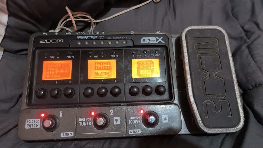 Zoom G3X Guitar Effects and Amp Simulator Pedal (Category: Musical Instruments) located in Manila. Submitted by knsenpai (Listing ID 1466999025, Image 1). Description: - Zoom G3X multi-effects pedal for electric guitar - Integrated expression pedal for real-time control - 3 large LCD screens for easy viewing of patches, delays, EQ, and leads - 3 footswitches for patch navigation, built-in tuner, and looper functions - Rear panel includes input, b
