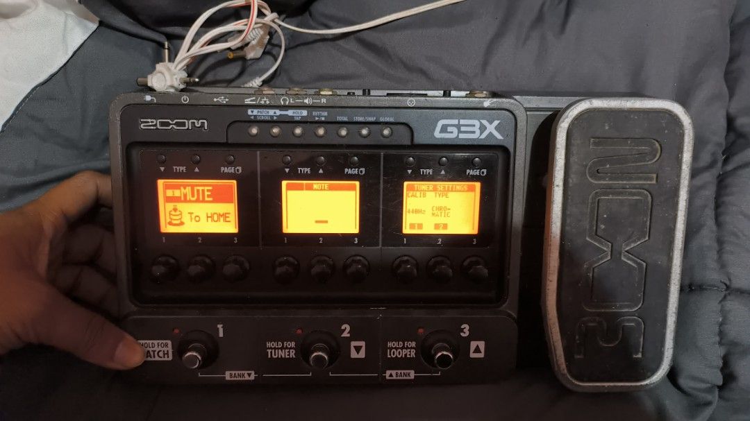 Zoom G3X Guitar Effects and Amp Simulator Pedal (Category: Musical Instruments) located in Manila. Submitted by knsenpai (Listing ID 1466999025, Image 3). Description: - Zoom G3X multi-effects pedal for electric guitar - Integrated expression pedal for real-time control - 3 large LCD screens for easy viewing of patches, delays, EQ, and leads - 3 footswitches for patch navigation, built-in tuner, and looper functions - Rear panel includes input, b