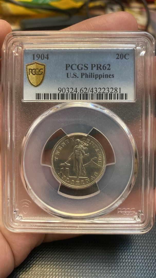 1904 US Philippines 20 Centavos PCGS PR62 (Category: Currency) located in Quezon City. Submitted by adonbilibit (Listing ID 1467279823, Image 1). Description: - Item: 1904 US Philippines 20 Centavos Coin - Grade: PCGS PR62 Proof - Encapsulation: Hard plastic protective slab (securely sealed) - Authenticity: Includes verification barcode and security hologram tape - Design: Standing figure on obverse, US eagle and shield on reverse.