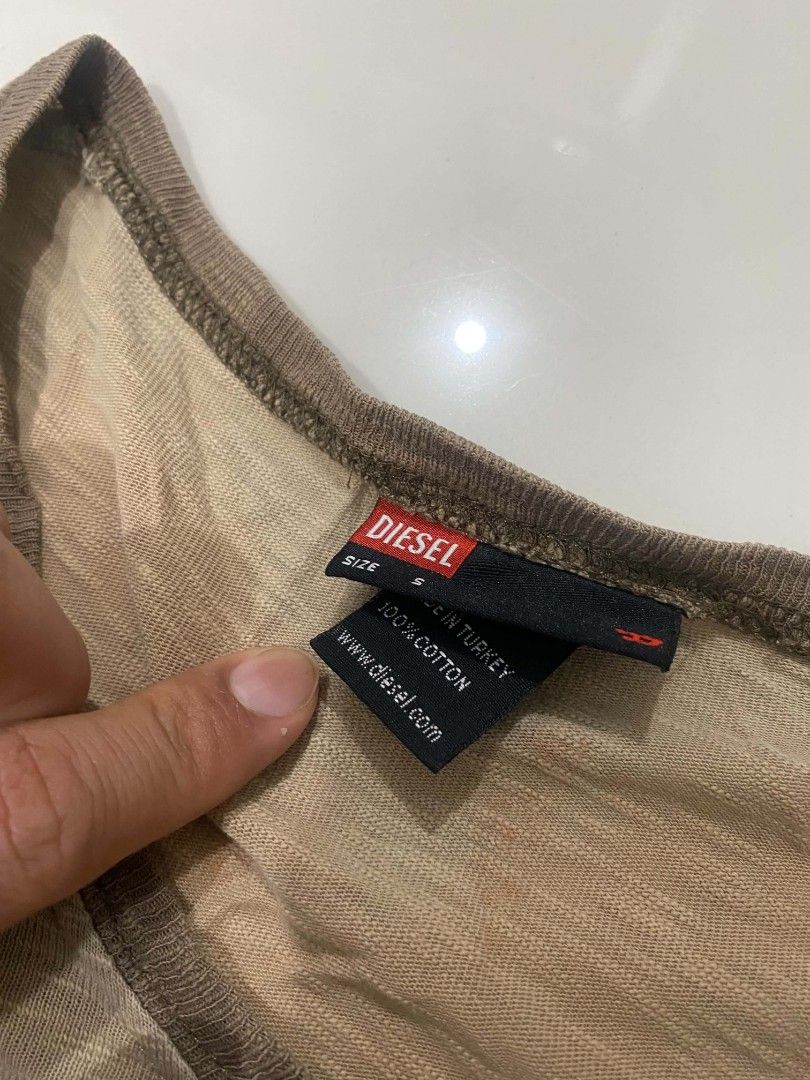 2000s Diesel Long Sleeve/Base Layer Top (Category: Coats, Jackets and Outerwear) located in Davao. Submitted by bulletproofssoul (Listing ID 1467325233, Image 3). Description: authentic, neckline is a little bit stretched, already washed, has slight discoloration, price is still negotiable. 📩 pm for negotiation & details..