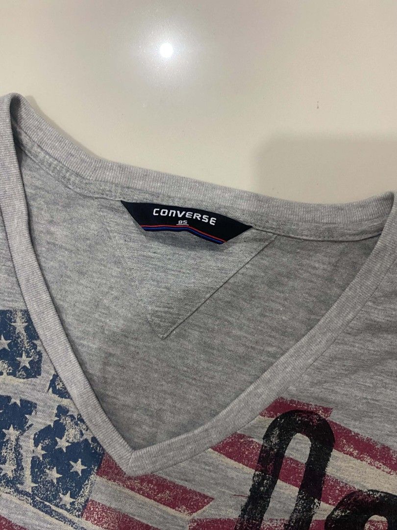 2000s V-neck Converse Shirt (Unisex) (Category: Tshirts & Polo Shirts ) located in Davao. Submitted by bulletproofssoul (Listing ID 1467323429, Image 3). Description: authentic, good condition, already washed, no issues, price is still negotiable. 📩 pm for negotiation & details. MEASUREMENTS: width (pit-to-pit) - 15.5 inches length - 23.5 inches.