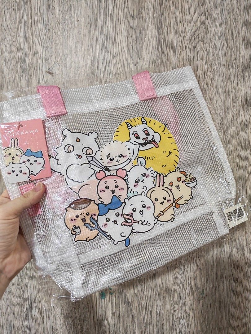 2 Chiikawa Clear Mesh Tote Bags (Category: Tote Bags) located in Manila. Submitted by declutter_sarah (Listing ID 1467321081, Image 1). Description: - Authentic Chiikawa clear mesh tote bag with cute character prints - Brand new, sealed in original plastic packaging - Features stylish branded straps reading "CHIIKAWA" - Two handle color options available: Pink or Yellow - Spacious and sturdy, perfect for daily essentials or convention shopping.