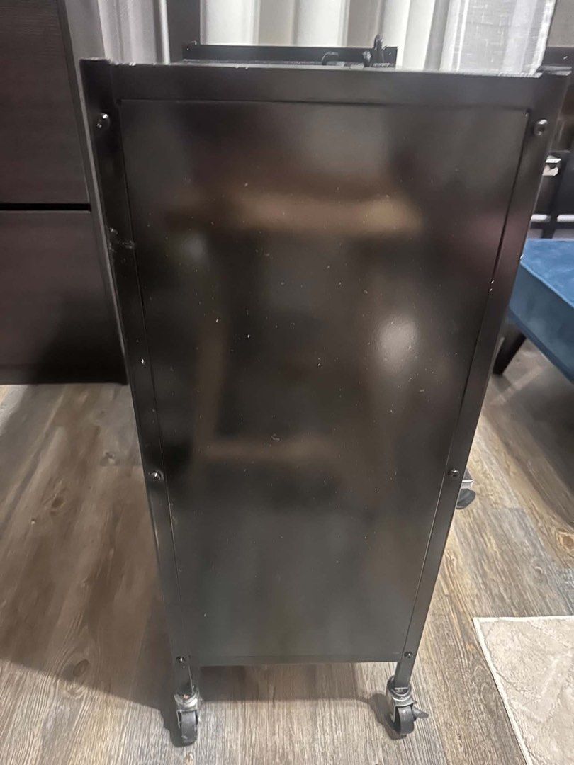 3-layer Rolling Storage Cabinet (Category: Shelves, Cabinets & Racks) located in Paranaque City. Submitted by mykindofclothing (Listing ID 1467288386, Image 3). Description: Sleek black 3-layer rolling storage cabinet with smooth wheels and translucent drop-down doors. Features two spacious compartments and a flat top surface for extra utility. Great for home or office organization. Originally white then spray painted with black.