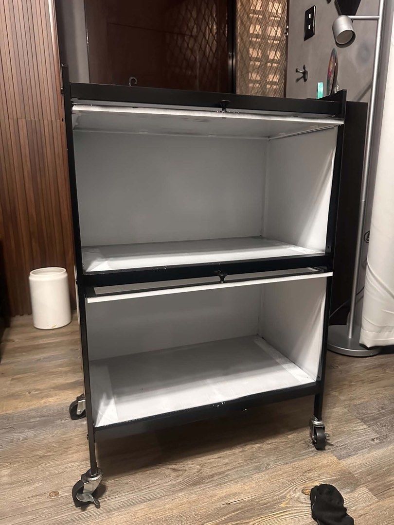 3-layer Rolling Storage Cabinet (Category: Shelves, Cabinets & Racks) located in Paranaque City. Submitted by mykindofclothing (Listing ID 1467288386, Image 2). Description: Sleek black 3-layer rolling storage cabinet with smooth wheels and translucent drop-down doors. Features two spacious compartments and a flat top surface for extra utility. Great for home or office organization. Originally white then spray painted with black.