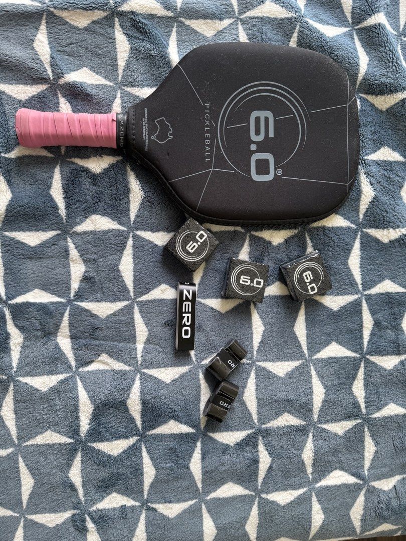 6.0 Six Zero Black Diamond Pickleball Paddle Set (Category: Racket and Ball Sports) located in Lapu Lapu. Submitted by andrewalst84649 (Listing ID 1467209304, Image 3). Description: - Item: Six Zero Black Diamond Pickleball Paddle - Color: Black with pink overgrip - Surface: Textured face for enhanced spin - Inclusions: Original protective cover, 3x Six Zero erasers for maintenance, extra overgrip rolls, and a Six Zero - Condition: Complete set, 