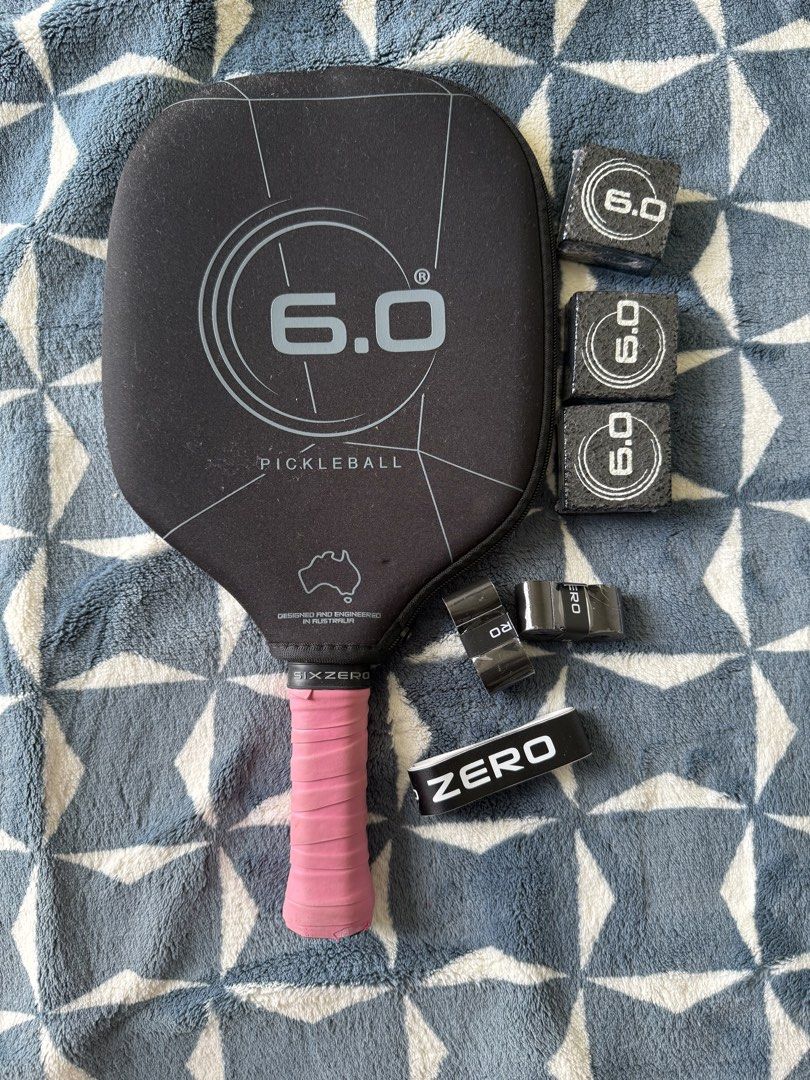 6.0 Six Zero Black Diamond Pickleball Paddle Set (Category: Racket and Ball Sports) located in Lapu Lapu. Submitted by andrewalst84649 (Listing ID 1467209304, Image 2). Description: - Item: Six Zero Black Diamond Pickleball Paddle - Color: Black with pink overgrip - Surface: Textured face for enhanced spin - Inclusions: Original protective cover, 3x Six Zero erasers for maintenance, extra overgrip rolls, and a Six Zero - Condition: Complete set, 