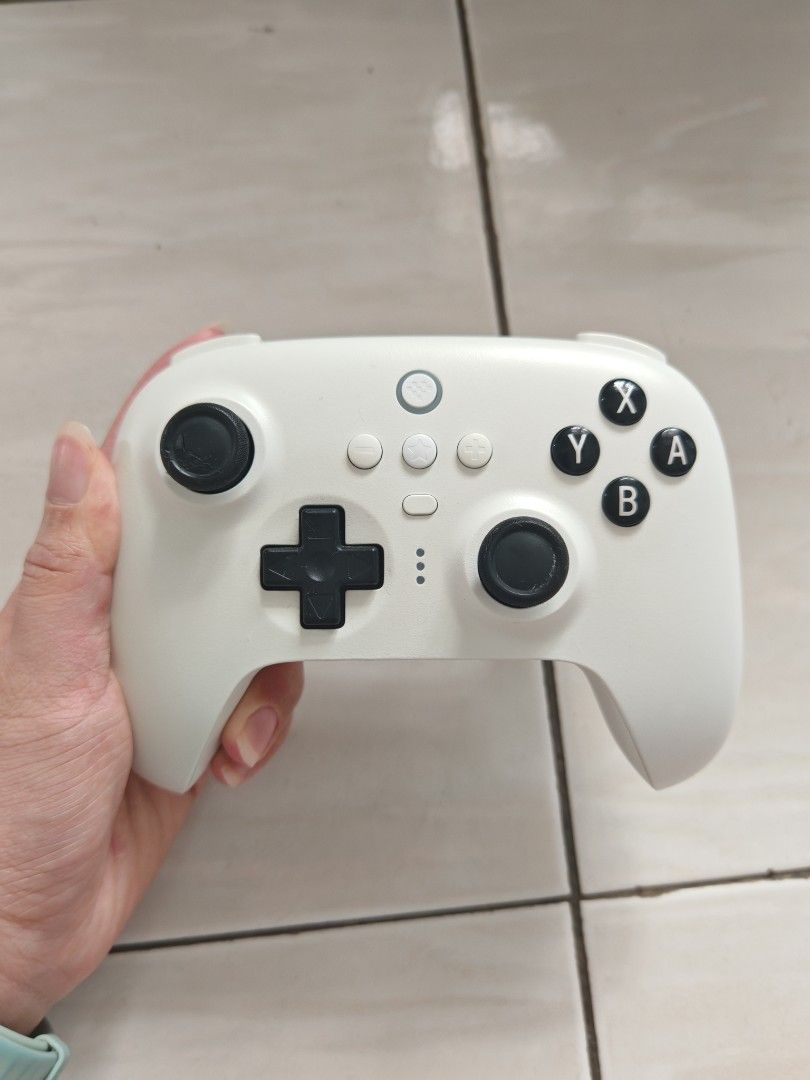 8BitDo Ultimate Bluetooth Controller (Switch/Windows) (Category: Controllers) located in Alor Setar. Submitted by abigailcheong (Listing ID 1467320010, Image 2). Description: - Model: 8BitDo Ultimate Bluetooth Controller (White) - Compatibility: Nintendo Switch & Windows PC - Inclusions: Matching charging dock and original box - Condition 7/10 - COD in Penang or +RM8 delivery fees.