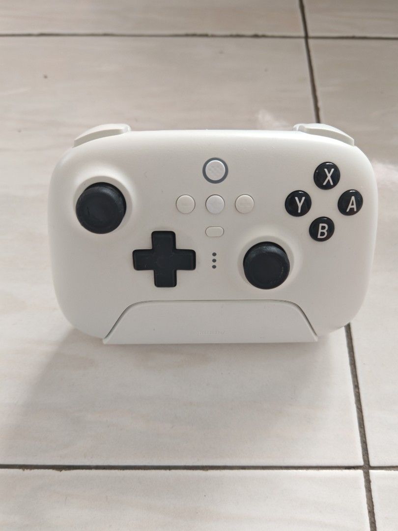 8BitDo Ultimate Bluetooth Controller (Switch/Windows) (Category: Controllers) located in Alor Setar. Submitted by abigailcheong (Listing ID 1467320010, Image 1). Description: - Model: 8BitDo Ultimate Bluetooth Controller (White) - Compatibility: Nintendo Switch & Windows PC - Inclusions: Matching charging dock and original box - Condition 7/10 - COD in Penang or +RM8 delivery fees.