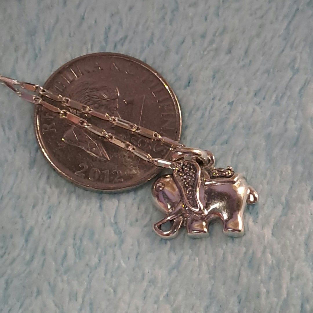 925 Silver Elephant Pendant Necklace (Category: Necklaces) located in Pila. Submitted by ester_aurea (Listing ID 1467212871, Image 2). Description: Silver Elephant Necklace with small stone 16 inches chain gcash + sf no cod - Material: Solid 925 sterling silver (stamped on clasp) - Design: Detailed elephant pendant with sparkling stone accents on the ear and saddle - Weight: 4.90 grams - Closure: Secure spring ring clasp - Perfect gift for animal