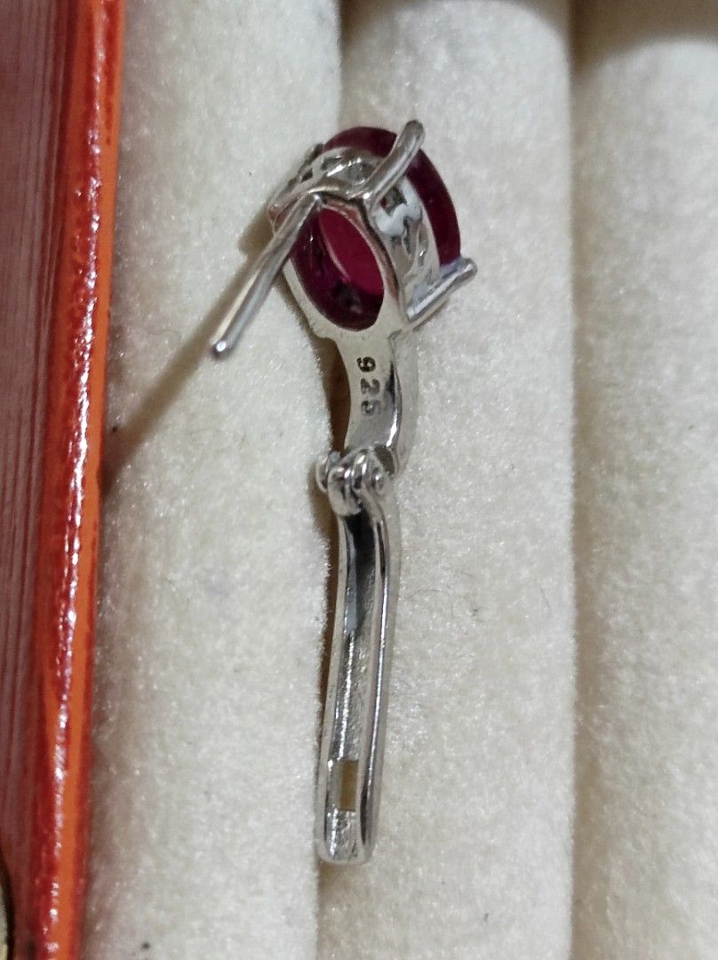 925 Silver Oval Ruby Gemstone Leverback Earrings (Category: Earrings) located in Cavite. Submitted by noblepenguin_6c8662 (Listing ID 1467229572, Image 3). Description: - Stunning oval ruby gemstone earrings - Crafted with 925 stamped sterling silver - Features secure leverback closure for easy and safe wear - Naturally fluorescent: glows bright pinkish-red under UV light - Securely prong-set stones with nicely polished metal in clean condition.