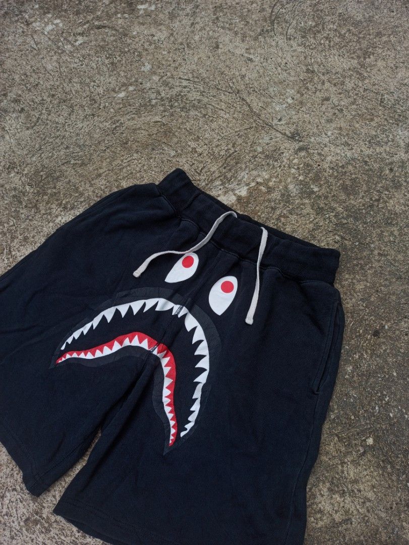 A Bathing Ape (BAPE) Shark Sweat Short (Category: Shorts) located in Baybay. Submitted by thrift_thrift_langg (Listing ID 1467362492, Image 2). Description: A Bathing Ape (BAPE) Shark Sweat Short W- Free (26-30) L- 18 Leg hole - 12.5 Color rate: 9/10 Issue: Hairline Very Good Condition.