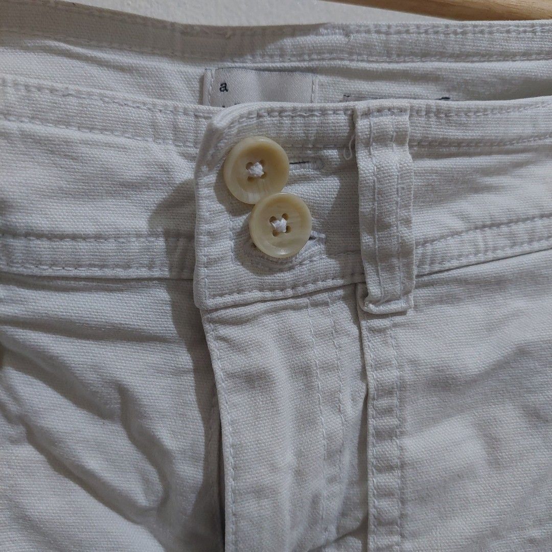 A New Day White Stretch Shorts (Category: Shorts) located in Governor Generoso. Submitted by cma_rarefitph (Listing ID 1467176865, Image 3). Description: - Brand: A New Day - Color: White - Style: Stretch shorts with front double-button closure and belt loops - Pockets: Large patch pockets on both front and back - Fit & Fabric: Clean fabric, comfortable stretch, great for warm weather - Versatility: Easy to style with casual tees and tank tops.