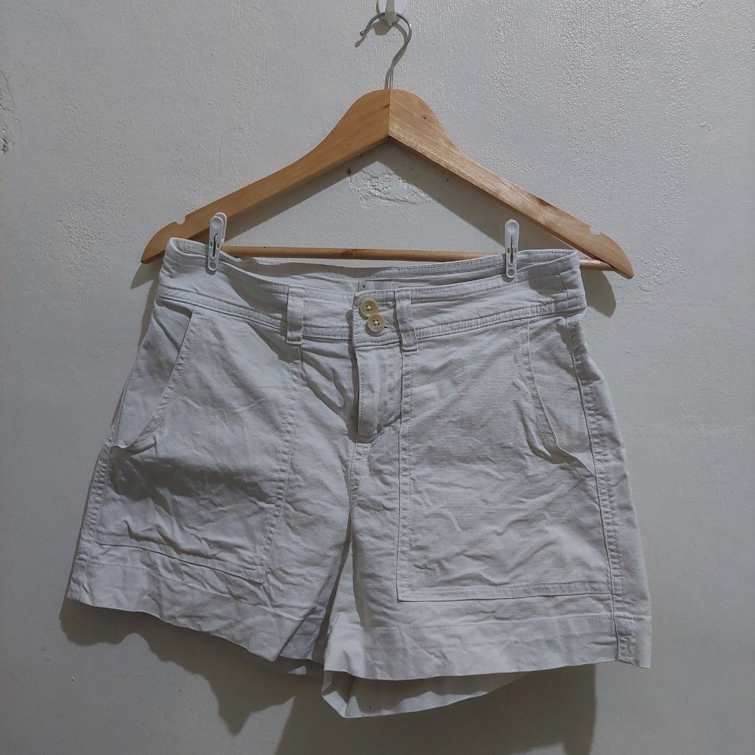 A New Day White Stretch Shorts (Category: Shorts) located in Governor Generoso. Submitted by cma_rarefitph (Listing ID 1467176865, Image 1). Description: - Brand: A New Day - Color: White - Style: Stretch shorts with front double-button closure and belt loops - Pockets: Large patch pockets on both front and back - Fit & Fabric: Clean fabric, comfortable stretch, great for warm weather - Versatility: Easy to style with casual tees and tank tops.
