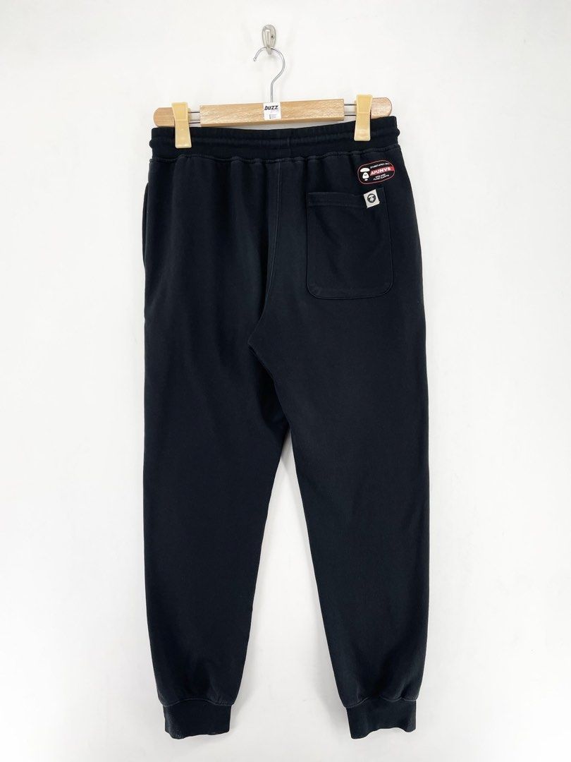AAPE Black Universe Jogger Pants (Category: Joggers) located in Manila. Submitted by buzz.garments (Listing ID 1467352597, Image 2). Description: Size: Large on tag Dimensions(inches) -Waist/Width: 30”-40” (Strechable) -Hip: 20” -Front Rise: 13” -Thigh: 12” -Inseam: 27” -Outseam/Length : 37” -Leg Opening: 5” - color may vary due to lighting. please manage your expectations-minimal and unseen flaws must be considered..