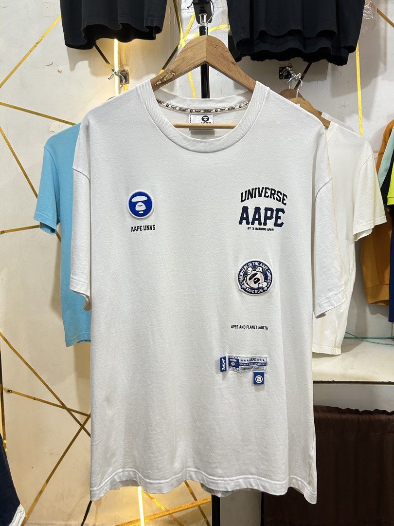 AAPE by A Bathing Ape White Patch T-Shirt (Category: Tshirts & Polo Shirts ) located in Manila. Submitted by cachegoodsuncovers (Listing ID 1467287371, Image 1). Description: Condition:Exellent close to brandnew Color rate:9.5/10 Size:L Dimes:23x30 Issue:none .